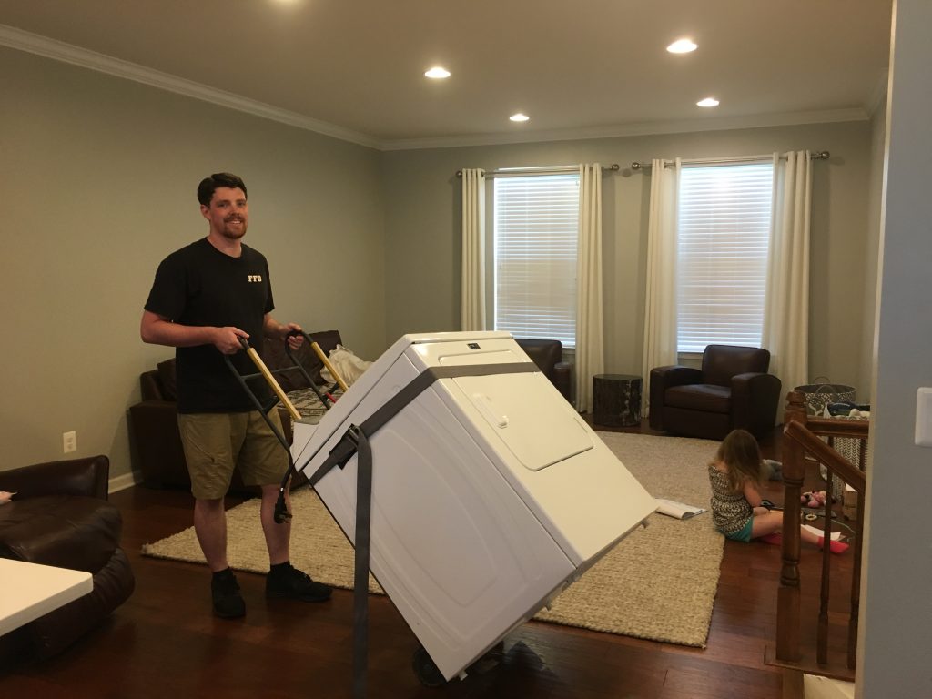 We survived carrying the world's heaviest washer and dryer down three flights of stairs (with only one little knick in the drywall)... and into a trailer... and across town to their new owners.