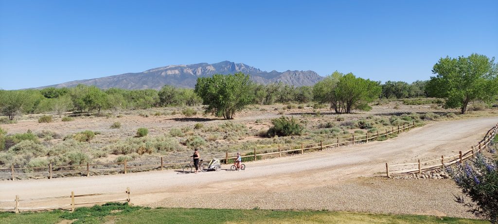 Ann K. Emery riding a bike in New Mexico.