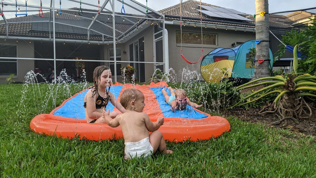 Ann K. Emery's kids on the slip 'n' slide in the backyard.