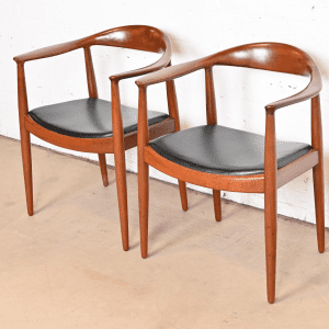 Hans Wegner for Johannes Hansen "The Chair" Teak and Leather Round Chairs, Pair, Newly Restored