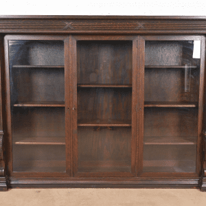 R. J. Horner Style American Empire Carved Oak Glass Front Triple Bookcase, Circa 1900