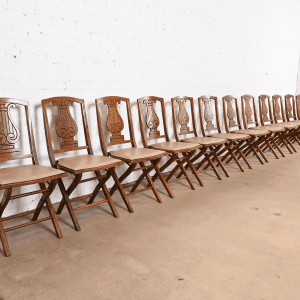 Antique Arts & Crafts Carved Oak Lyre Back Folding Dining Chairs by Phoenix Chair Co., Set of Twelve