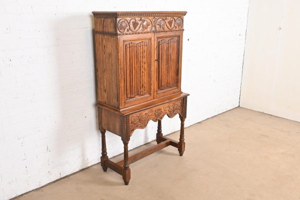 English Jacobean Carved Oak Bookcase or Bar Cabinet by Irwin, Circa 1920s - Image 4