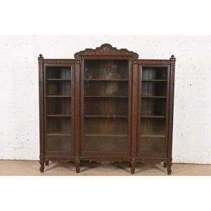 R. J. Horner Style Antique Victorian Carved Oak Triple Bookcase, Circa 1890s