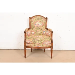 Baker Furniture Style French Regency Louis XVI Carved Walnut Bergere Armchair, Circa 1960s