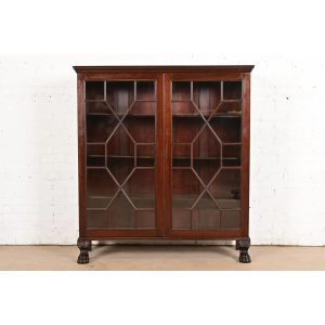 R. J. Horner Style Antique American Empire Carved Mahogany Bookcase With Lion's Paw Feet, Circa 1890s
