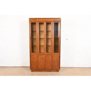 Drexel Heritage Mid-Century Hollywood Regency Campaign Carved Walnut Lighted Bookcase or Display Cabinet