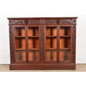 R. J. Horner Style Antique Victorian Carved Walnut Double Bookcase Cabinet, Circa 1890s