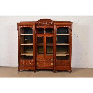 R. J. Horner Style Antique Victorian Carved Cherry Wood Triple Bookcase, Circa 1880s