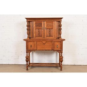 Antique English Jacobean Carved Oak Bar Cabinet, Circa 1920s