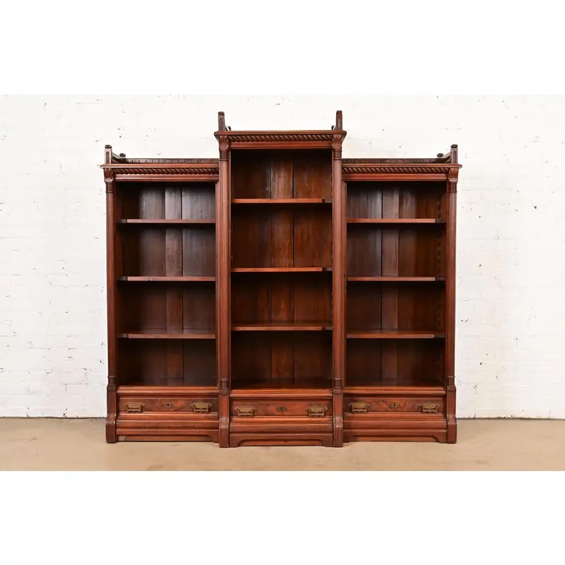 Herter Brothers Style Antique Eastlake Victorian Carved Walnut and Burl Wood Triple Bookcase, Circa 1880s