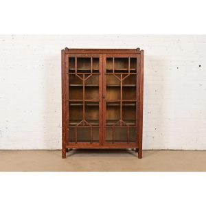 Antique French Renaissance Revival Carved Oak Breakfront Bookcase or Bar Cabinet With Stained Leaded Glass Doors, Circa 1890s