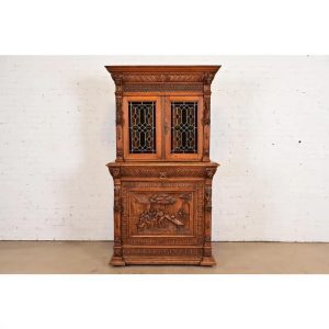 Antique French Renaissance Revival Carved Oak Breakfront Bookcase or Bar Cabinet With Stained Leaded Glass Doors, Circa 1890s