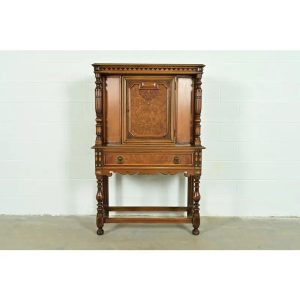 Berkey & Gay Antique English Jacobean Carved Walnut and Burl Wood Bookcase or Bar Cabinet, Circa 1920s
