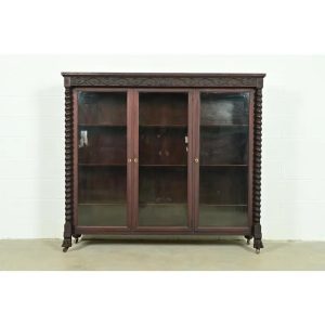 R. J. Horner Style American Empire Carved Mahogany Triple Bookcase With Lion Paw Feet, Circa 1890s