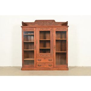 R. J. Horner Style Antique Victorian Carved Oak Triple Bookcase, Circa 1880s