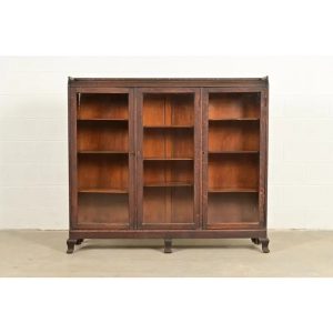 R. J. Horner Style Victorian Carved Oak Glass Front Triple Bookcase, Circa 1890s