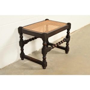 Berkey & Gay Style Antique English Jacobean Carved Walnut and Cane Stool or Ottoman, Circa 1920s